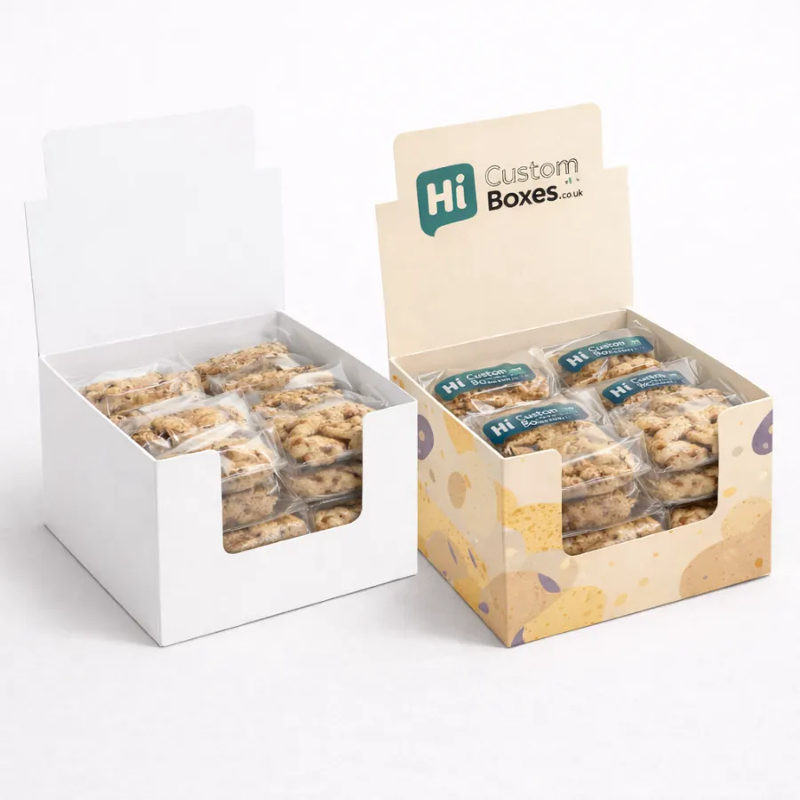 Two counter display boxes filled with individually wrapped biscuits- including a branded cream-coloured version- class=